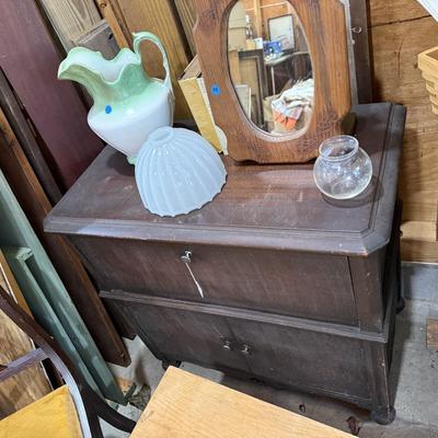 Sale Photo Thumbnail #198: Garage 3: table, miscellaneous kitchen & decor, rocker, early twin bed, dresser, cabinet, scrap wood, curtain rods, project chairs, reupholstering supplies, mirrors, baby scale, lantern, pitcher, storage contain, laundry basket & more