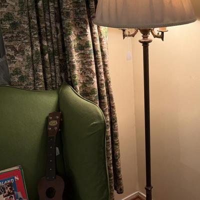 Sale Photo Thumbnail #229: Rocker, wing back chair w/ottoman, carved cherub lamp, milk glass, dish set, crystal, china, tea cups, vases, colored glass, sheet music, frames, Boy Scouts, silver-plate, pottery, large vase, floor lamp, Christmas music, yukele, Bibles
DOES NOT INCLUDE T