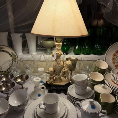 Sale Photo Thumbnail #227: Rocker, wing back chair w/ottoman, carved cherub lamp, milk glass, dish set, crystal, china, tea cups, vases, colored glass, sheet music, frames, Boy Scouts, silver-plate, pottery, large vase, floor lamp, Christmas music, yukele, Bibles
DOES NOT INCLUDE T