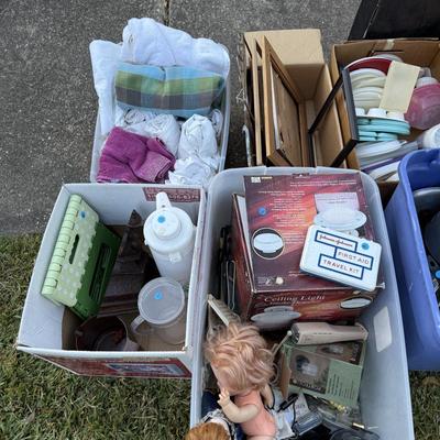 Sale Photo Thumbnail #286: Pans, linens, Tupperware, frames, light fixtures, toys, paper goods, bakeware, new lamp shades, new oak bathroom towel racks & more