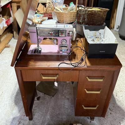 Sale Photo Thumbnail #297: Middle garage: bed, counter chair, currier & Ives hanging light, luggage, pottery vases, sewing machine, canopy, Formica kitchen table, dvd/cd stand, dishes, glassware, misc