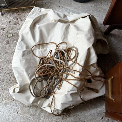 Sale Photo Thumbnail #304: Middle garage: bed, counter chair, currier & Ives hanging light, luggage, pottery vases, sewing machine, canopy, Formica kitchen table, dvd/cd stand, dishes, glassware, misc