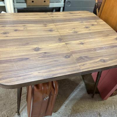 Sale Photo Thumbnail #302: Middle garage: bed, counter chair, currier & Ives hanging light, luggage, pottery vases, sewing machine, canopy, Formica kitchen table, dvd/cd stand, dishes, glassware, misc