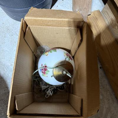 Sale Photo Thumbnail #320: Middle garage: saw horses, long boards, misc kitchen items, fan, cabinet, chair, painting tools, coffee maker, toaster, toaster ovens, hanging lamp, scrap wood, & more