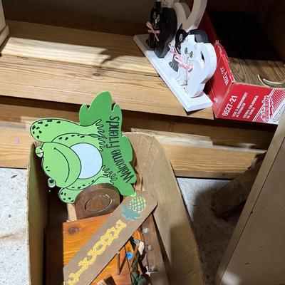 Sale Photo Thumbnail #316: Middle garage: saw horses, long boards, misc kitchen items, fan, cabinet, chair, painting tools, coffee maker, toaster, toaster ovens, hanging lamp, scrap wood, & more