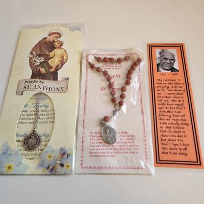 Sale Photo Thumbnail #222: This auction lot is for a gathering of Religious Relics, Beads, Medal & Prayer Cards.  This grouping includes "touched-to" relics of St. Jude, St. Theresa, St. Francis of Assissi and St. Faustina.  Also included is a St. Theresa Chaplet of Beads and a med