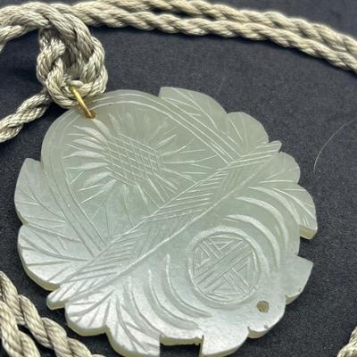 LOT 150: Vintage Certified Jade Pendant on Rope with Floral Case