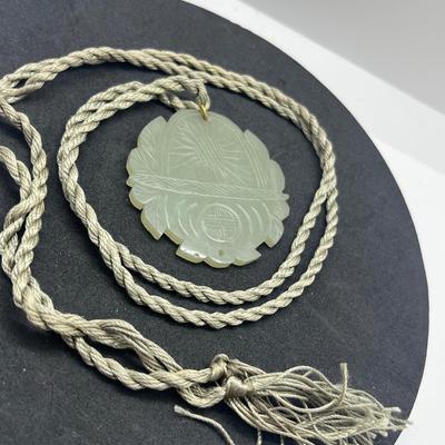 LOT 150: Vintage Certified Jade Pendant on Rope with Floral Case