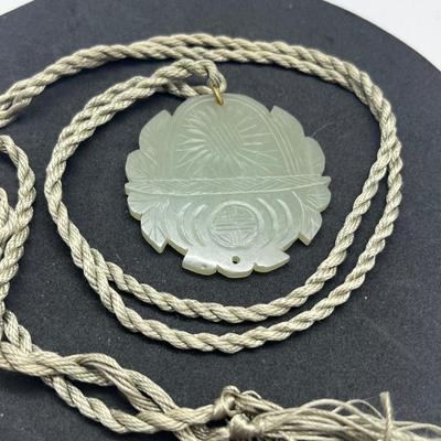 LOT 150: Vintage Certified Jade Pendant on Rope with Floral Case