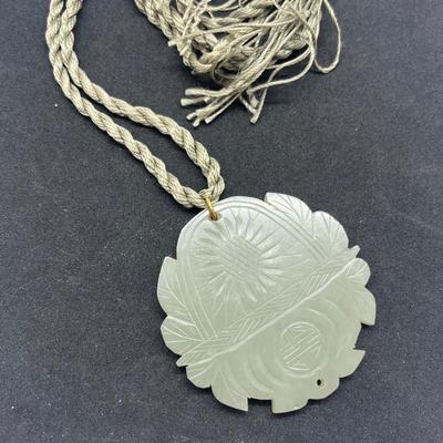 LOT 150: Vintage Certified Jade Pendant on Rope with Floral Case