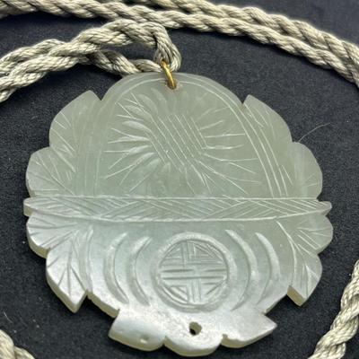 LOT 150: Vintage Certified Jade Pendant on Rope with Floral Case