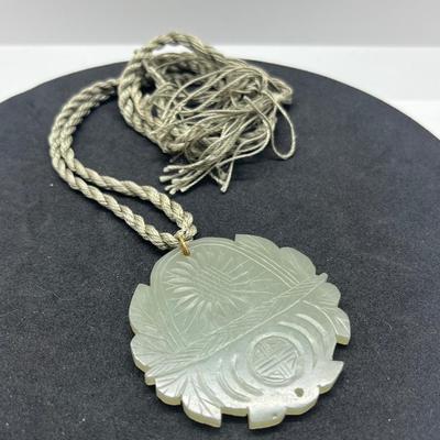 LOT 150: Vintage Certified Jade Pendant on Rope with Floral Case