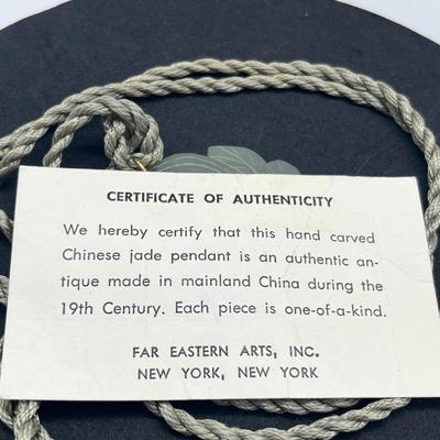 LOT 150: Vintage Certified Jade Pendant on Rope with Floral Case
