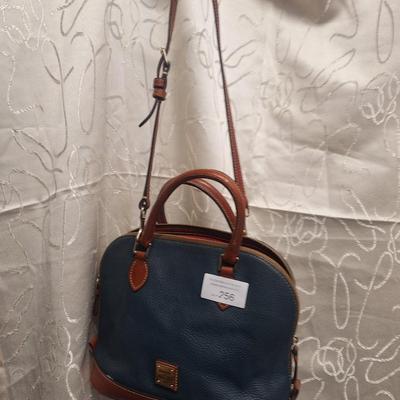 Sale Photo Thumbnail #960: the inside is dirty and on the outside there is small spots that look like someone spilled or smeared a tough of gold glitter paint.  We don't think it's original but weren't sure so we didn't try cleaning it off other than to wipe with a leather wipe.  