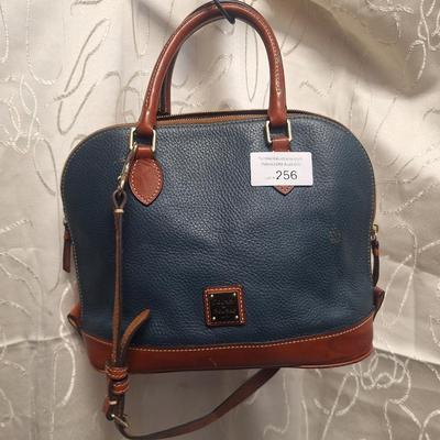 Sale Photo Thumbnail #956: the inside is dirty and on the outside there is small spots that look like someone spilled or smeared a tough of gold glitter paint.  We don't think it's original but weren't sure so we didn't try cleaning it off other than to wipe with a leather wipe.  