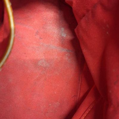 Sale Photo Thumbnail #964: the inside is dirty and on the outside there is small spots that look like someone spilled or smeared a tough of gold glitter paint.  We don't think it's original but weren't sure so we didn't try cleaning it off other than to wipe with a leather wipe.  