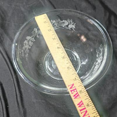 Three vintage Pyrex clear glass nesting mixing bowls in the "Colonial Mist" or "White Lace" pattern.