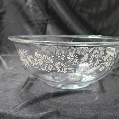 Three vintage Pyrex clear glass nesting mixing bowls in the "Colonial Mist" or "White Lace" pattern.