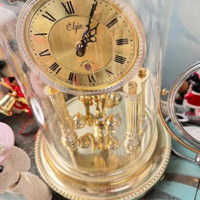 Sale Photo Thumbnail #155: Dolls, praying, wedding Teddy bear, Large porcelain angel, dog figurines, Betty Boop, Mickey Mouse. New Lenox set in box, 3 Royal Dalton porcelain flower pieces in good condition. Perpetual clock, with glass dome, untested needs new battery, but all there