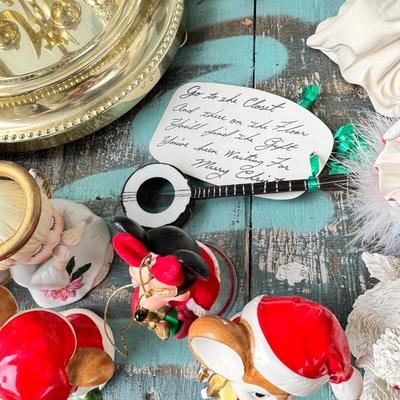 Sale Photo Thumbnail #156: Dolls, praying, wedding Teddy bear, Large porcelain angel, dog figurines, Betty Boop, Mickey Mouse. New Lenox set in box, 3 Royal Dalton porcelain flower pieces in good condition. Perpetual clock, with glass dome, untested needs new battery, but all there