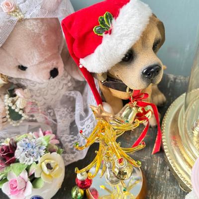 Sale Photo Thumbnail #154: Dolls, praying, wedding Teddy bear, Large porcelain angel, dog figurines, Betty Boop, Mickey Mouse. New Lenox set in box, 3 Royal Dalton porcelain flower pieces in good condition. Perpetual clock, with glass dome, untested needs new battery, but all there