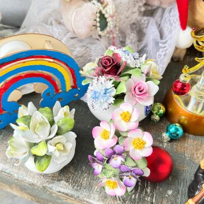 Sale Photo Thumbnail #151: Dolls, praying, wedding Teddy bear, Large porcelain angel, dog figurines, Betty Boop, Mickey Mouse. New Lenox set in box, 3 Royal Dalton porcelain flower pieces in good condition. Perpetual clock, with glass dome, untested needs new battery, but all there
