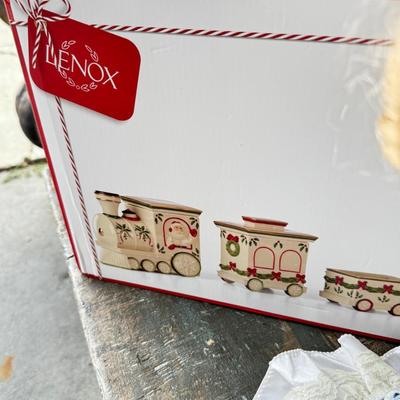 Sale Photo Thumbnail #148: Dolls, praying, wedding Teddy bear, Large porcelain angel, dog figurines, Betty Boop, Mickey Mouse. New Lenox set in box, 3 Royal Dalton porcelain flower pieces in good condition. Perpetual clock, with glass dome, untested needs new battery, but all there