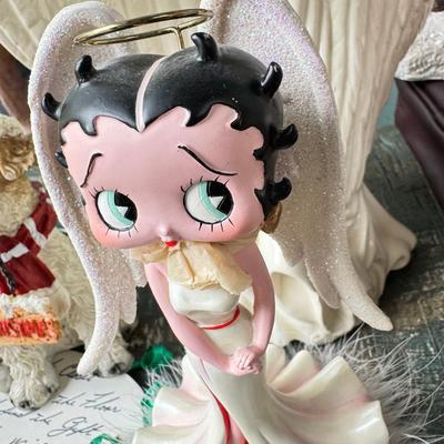 Sale Photo Thumbnail #164: Dolls, praying, wedding Teddy bear, Large porcelain angel, dog figurines, Betty Boop, Mickey Mouse. New Lenox set in box, 3 Royal Dalton porcelain flower pieces in good condition. Perpetual clock, with glass dome, untested needs new battery, but all there