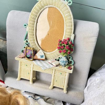 Sale Photo Thumbnail #149: Dolls, praying, wedding Teddy bear, Large porcelain angel, dog figurines, Betty Boop, Mickey Mouse. New Lenox set in box, 3 Royal Dalton porcelain flower pieces in good condition. Perpetual clock, with glass dome, untested needs new battery, but all there