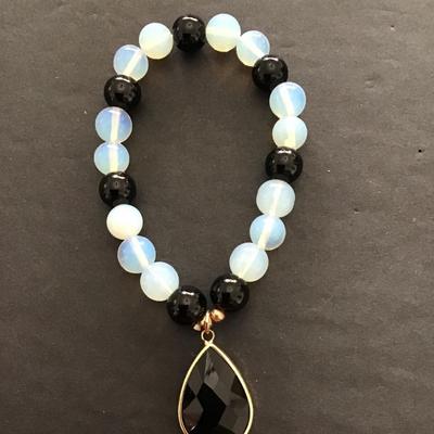 Sale Photo Thumbnail #46: Beautiful glass beaded stretch bracelet with pendant . Please see attached photos.