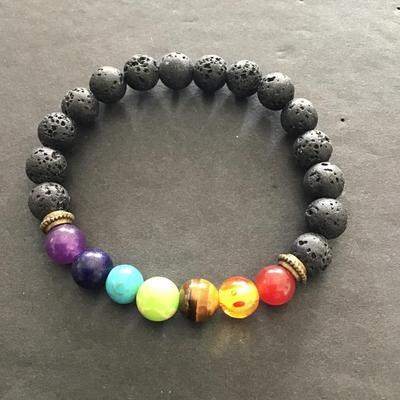 Sale Photo Thumbnail #48: Multicolored  glass beaded stretch bracelet with lava stones. Please see attached photos.