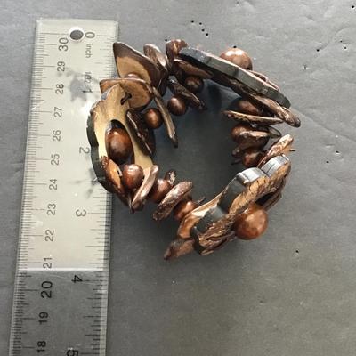 Sale Photo Thumbnail #90: Very nice vintage hand carved wood stretchy bracelet. Please see attached photos.