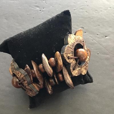 Sale Photo Thumbnail #89: Very nice vintage hand carved wood stretchy bracelet. Please see attached photos.