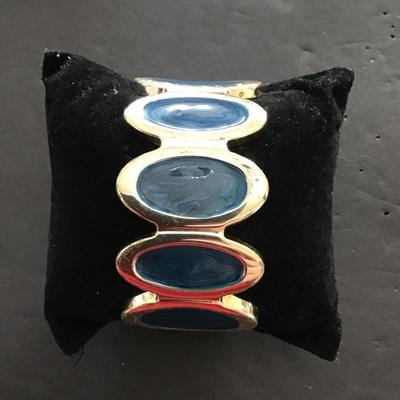 Sale Photo Thumbnail #93: Gold tone with blue enamel hinged bracelet. Please see attached photos.