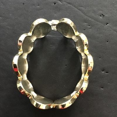 Sale Photo Thumbnail #94: Gold tone with blue enamel hinged bracelet. Please see attached photos.