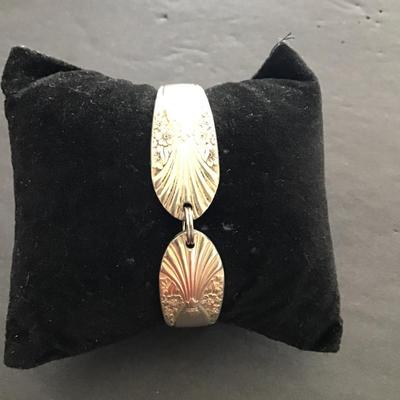 Sale Photo Thumbnail #135: Silver Plated spoon and bracelet. Please see attached photos.