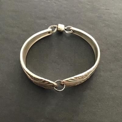 Sale Photo Thumbnail #134: Silver Plated spoon and bracelet. Please see attached photos.