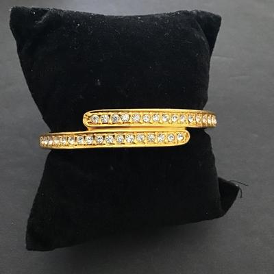 Sale Photo Thumbnail #154: Gold tone bracelet with rhinestone hinged. Please see attached photos.