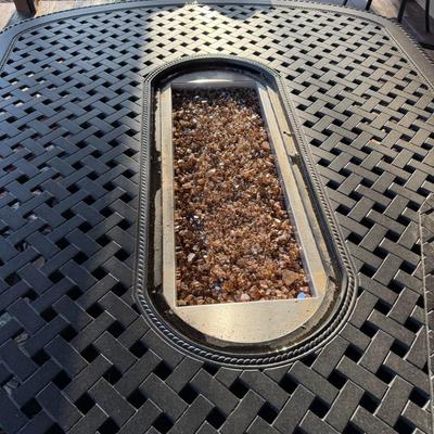 Sale Photo Thumbnail #1063: Black Cast Aluminum Outdoor Dining Table with Center Fire Pit, Six Swivel Chairs and cushions    Propane Fire Pit