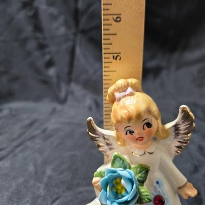 Vintage Lefton July Birthday Angel figurine, style #6224, featuring a ruby-red birthstone and blue flowers.