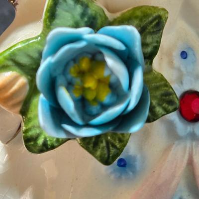 Vintage Lefton July Birthday Angel figurine, style #6224, featuring a ruby-red birthstone and blue flowers.