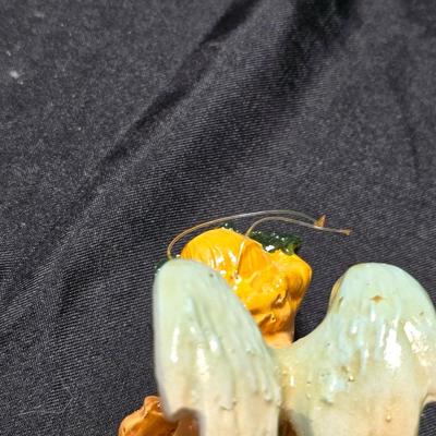 Vintage Fontanini Depose Italy cherub figurine, one standing and playing a violin, the other reclining with a floral garland.