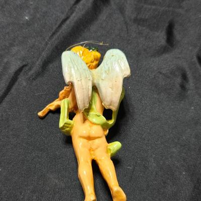 Vintage Fontanini Depose Italy cherub figurine, one standing and playing a violin, the other reclining with a floral garland.