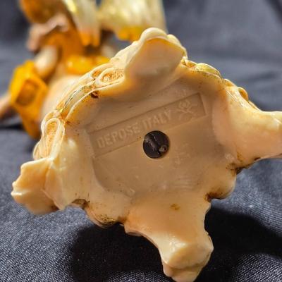 Vintage Fontanini Depose Italy cherub figurine, one standing and playing a violin, the other reclining with a floral garland.