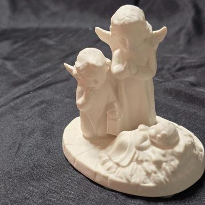 Goebel Hummel HX 312 Angels with Baby Jesus figurine in white bisque porcelain. It was produced in 1961 in West Germany