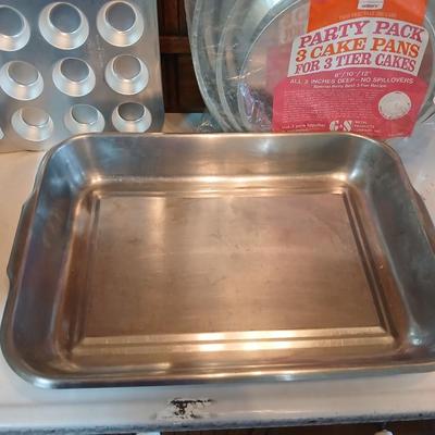 Bake ware = New Best Party pack 3 cake pan - 3 tiered cakes - Foly muffin tins - New Oneida 8" square cake pan and a large cake pan