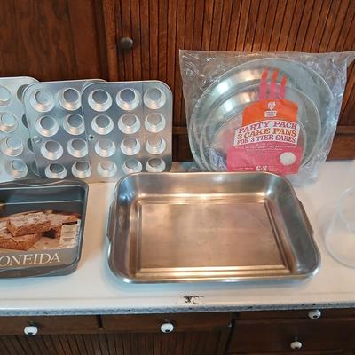 Bake ware = New Best Party pack 3 cake pan - 3 tiered cakes - Foly muffin tins - New Oneida 8" square cake pan and a large cake pan