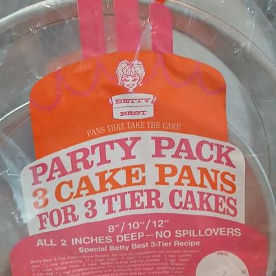 Bake ware = New Best Party pack 3 cake pan - 3 tiered cakes - Foly muffin tins - New Oneida 8" square cake pan and a large cake pan
