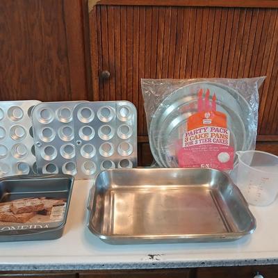 Bake ware = New Best Party pack 3 cake pan - 3 tiered cakes - Foly muffin tins - New Oneida 8" square cake pan and a large cake pan