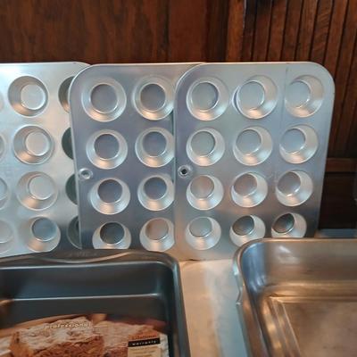 Bake ware = New Best Party pack 3 cake pan - 3 tiered cakes - Foly muffin tins - New Oneida 8" square cake pan and a large cake pan